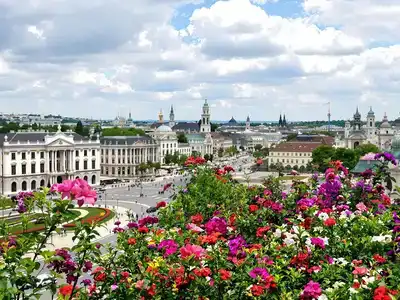 Vienna&rsquo;s historic buildings with flowers and people enjoying.