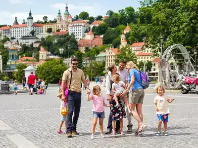 Family exploring attractions in Prague with joy and laughter.