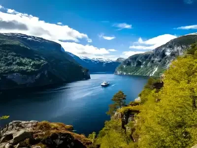 Norwegian fjord with snow capped mountains