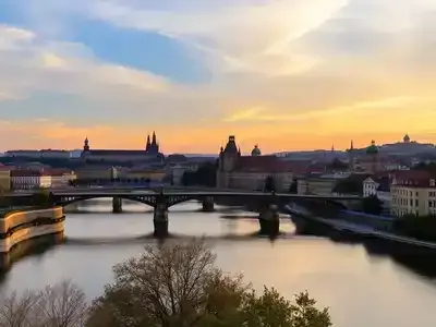 Prague skyline with Charles Bridge at sunset.
