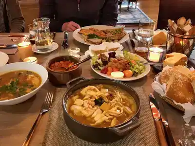 Traditional Finnish meal with salmon soup and reindeer stew.