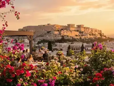 Couples dining with a sunset view of the Acropolis.