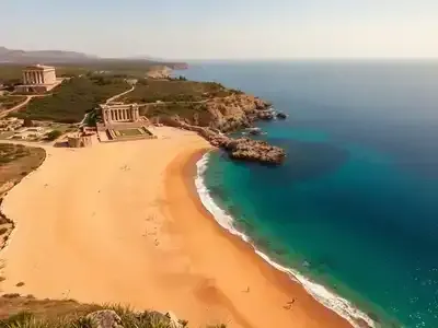 Historic beach in Greece with ruins and clear waters.