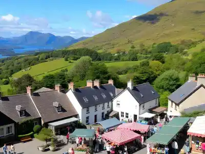 Scenic Killarney landscape with cottages and lush greenery.