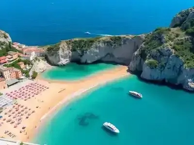 Beautiful Amalfi Coast beach with clear waters and cliffs.