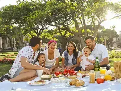 Family enjoying a picnic in a Roman park.