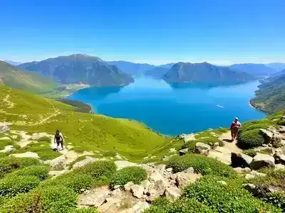 Hikers on a trail overlooking the stunning Italian Lakes.
