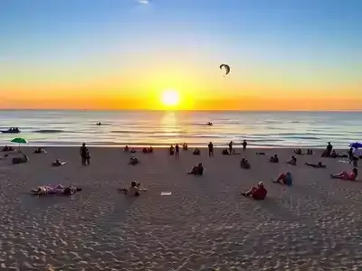 Vibrant beach scene with water sports in Viareggio, Italy.