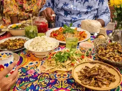 Couples and families dining on traditional Lagos cuisine.