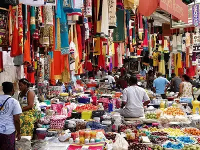 Vibrant Lagos market with colorful stalls and shoppers.