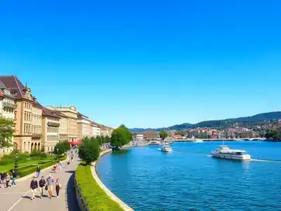 Sunset over Zurich lake with historic buildings and Alps.