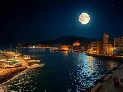 Happy couple walking beneath Antalya moonlit sky along lively waterfront.
