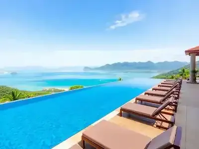 Infinity pool surrounded by lush greenery at Nirvana Lagoon.