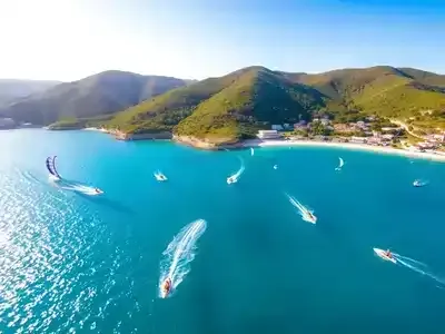 Colorful water sports scene on a Turkish coastline.